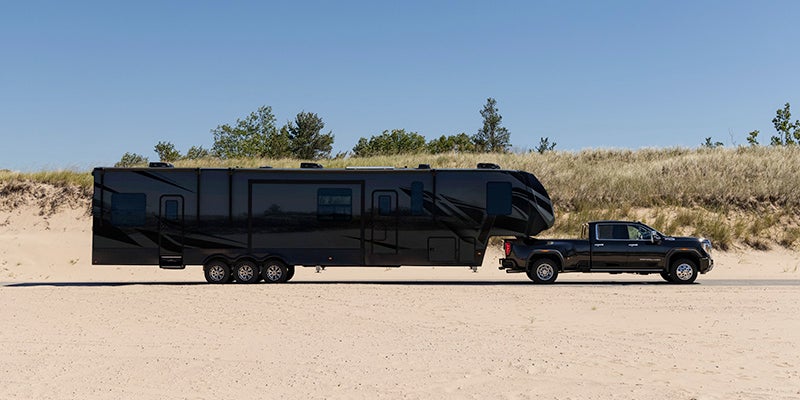 A 2024 GMC Sierra HD towing a large trailer near Beloit, Wisconsin.